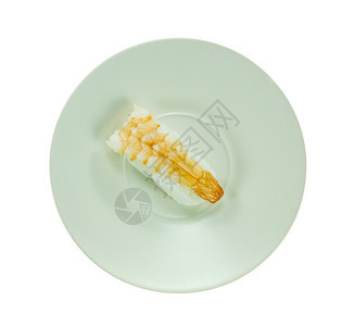 最上面的虾寿司在白色背景的盘子上查看虾寿司图片