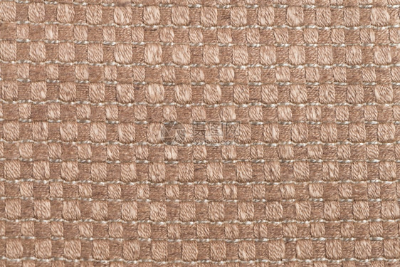 棕色地毯纹理背景的特写细节图片