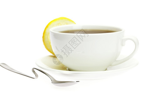 白杯勺子和柠檬图片