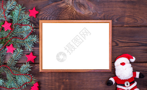 棕色背景的空木板和纺织圣诞老人图片