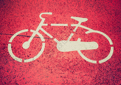 旧的自行车道上的Stencil自行车牌图片