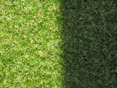 绿色人工合成草原背景绿色人工合成草质作为背景有用阳光和影子点图片