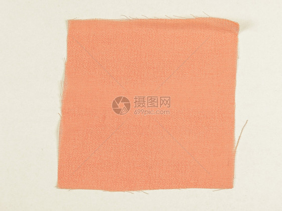 古老的橙色布料样本古老的橙色布料在白背景上遮罩着橙色布料图片