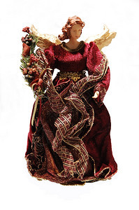 一个美丽的圣诞娃天使穿着长的布根迪裙子站在白色背景图片