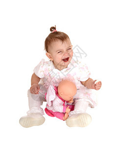 坐在地板上笑着玩海草莉的小女婴被白种背景隔离背景图片