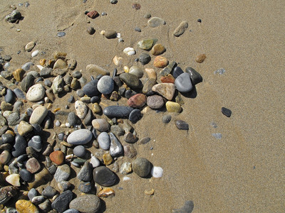 石螺口海滩湿沙底带海石块的湿沙底背景