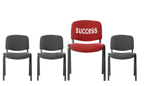 红色椅子上面有刻着文字的成功它在白色背景上被孤立图片