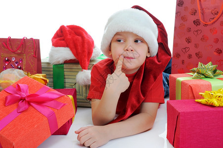 穿着圣诞礼帽的快乐男孩孤立于白种背景图片