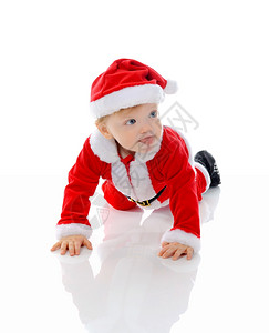 穿着圣诞老人帽子的快乐男孩孤立于白种背景图片