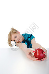 手拿着苹果的年轻女子孤立在白色背景上图片