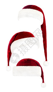 一套红色圣诞老人帽子孤立在白色背景上背景图片