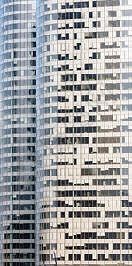 有着众多窗口的摩天大楼墙壁建筑背景图片