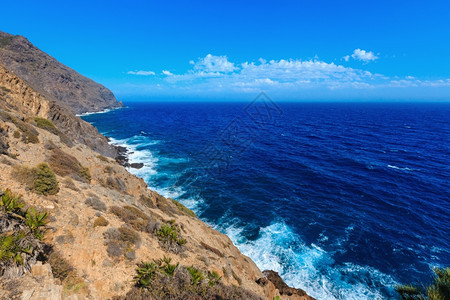 地中海洋夏季岩石岸观察PortmanCostaBlanca西班牙图片