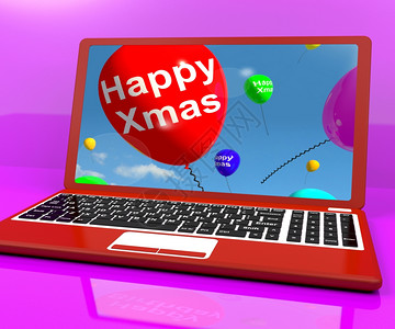 在电脑上放上圣诞快乐的红气球用于在线问候电脑上圣诞快乐的红气球显示在线问候图片