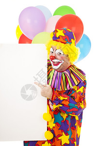 马戏团快乐的小丑指向一个空白的标志准备收听你的短信图片