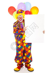 快乐的小丑指向空白牌子准备发短信全身在白色上被隔离图片