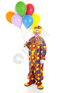 一个快乐的小丑拿着一堆多彩气球全身孤立的视线图片
