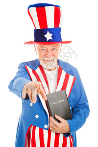 美国图标山姆叔拿着一本圣经指你白的孤立图片