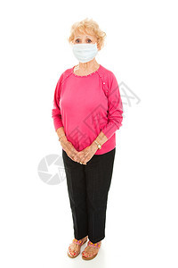 一名身着面罩的高级妇女被完全隔绝的视线看得一清二楚以防范流行病的蔓延图片