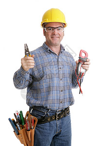 安全护目镜和硬帽的电工举起他铁丝网和电压计真实和准确的内容描述模型是实际的主电工图片