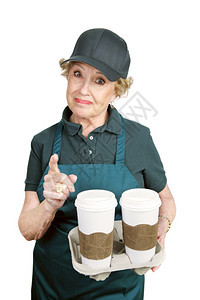一家咖啡店的高级工人愤怒地面对一个困难的顾客图片