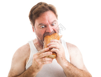 一个穿着内衣的无毛男人幽默照片他吃着一个大型的潜艇套餐三明治图片