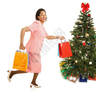 非裔美洲女从一家商店跑到另为圣诞礼物讨价还图片