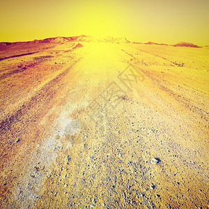 日落在以色列的石沙漠上回溯效应图片