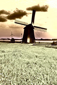 景色与旧荷兰风车在日落时景背景图片