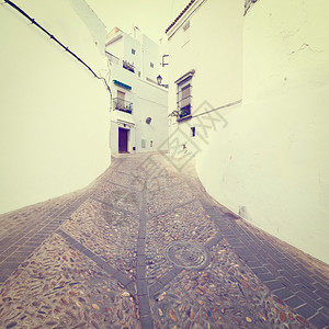西班牙房屋之间的窄巷图片