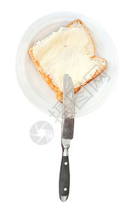 白板上面包和黄油三明治的顶部视图白背景上的刀片图片
