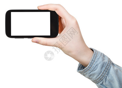 手持触摸屏幕电话的衬衫用白色背景隔离的剪掉屏幕电话图片