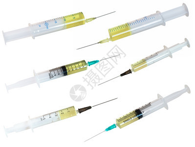 一组填充白色背景上孤立的黄色液体注射器图片