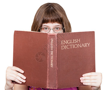 用眼镜看英国词典本孤立在白色背景的英国字典书图片