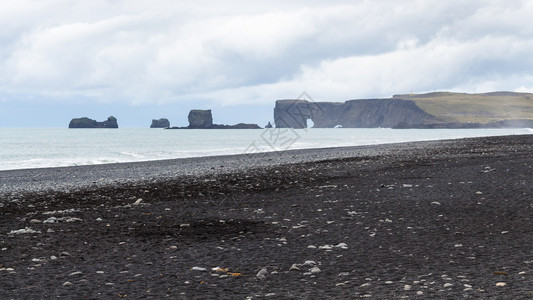 前往冰岛雷尼斯菲亚拉黑沙滩在9月卡特拉地质公园的大西洋南岸VikIMyrdal村附近观赏冰岛的Dyrholaeycape图片