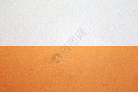 水泥墙漆成橙色和奶油颜的背景背景图片