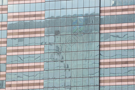 高楼墙或摩天大的玻璃背景设计在您的工作背景图片