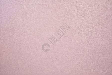 脏墙在你的工作背景概念中设计浅粉色脏水泥墙的背景背景