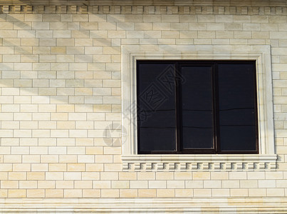 黄砖和窗口的背景黄砖墙壁带有塑料窗口墙的纹理黄砖墙壁带有塑料窗口墙的纹理图片
