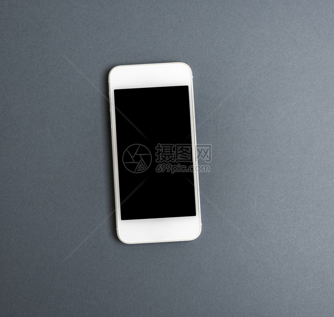 白智能手机灰色背景顶视图上有空白黑屏色智能手机图片