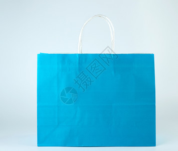 蓝纸购物袋有白色背景的手柄关闭图片