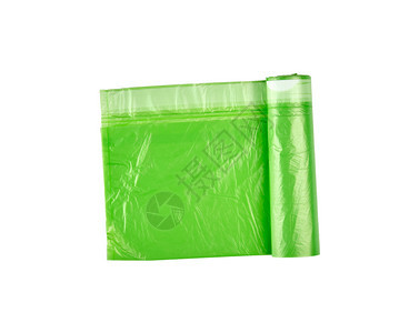 用于在白色背景上孤立的垃圾桶扭曲绿色塑料袋图片