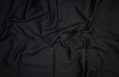 黑色棉布的碎片与波浪完整的框架关闭图片