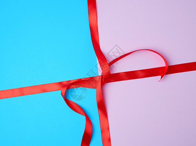 彩色背景的红带子仿照捆绑和包装礼物图片