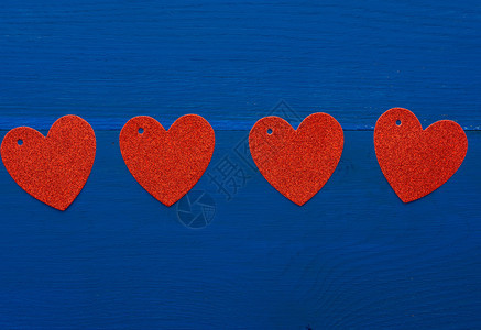 深蓝木背景上的红光亮装饰心情人节日的抽象背景图片