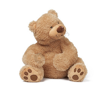棕褐色大泰迪熊坐在白色的孤立背景上有趣的小孩玩具图片