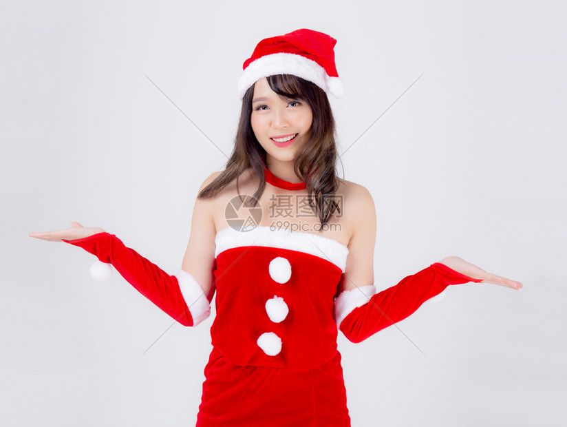 美丽的肖像年轻的亚洲妇女圣诞老人服装呈现空格子与快乐的节日圣诞节美丽的模特亚洲女孩快乐和惊喜庆祝圣诞节隔离在白色背景上图片