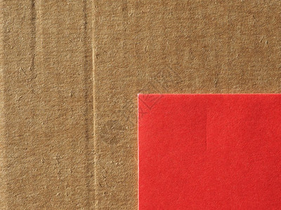 褐色涂层纸板和红纹理作为背景有用褐色涂层纸板和红纹理背景图片