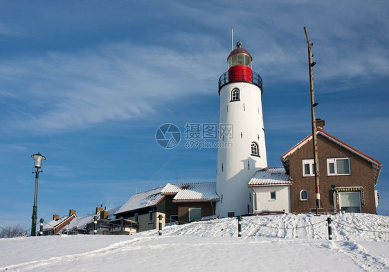 荷兰渔业村乌尔克冬季荷兰灯塔图片