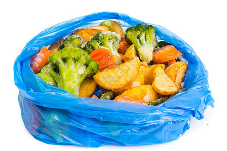 一张蓝色袋中冻结的混合蔬菜一张工作室照片一张蓝色袋中冻结的混合蔬菜图片